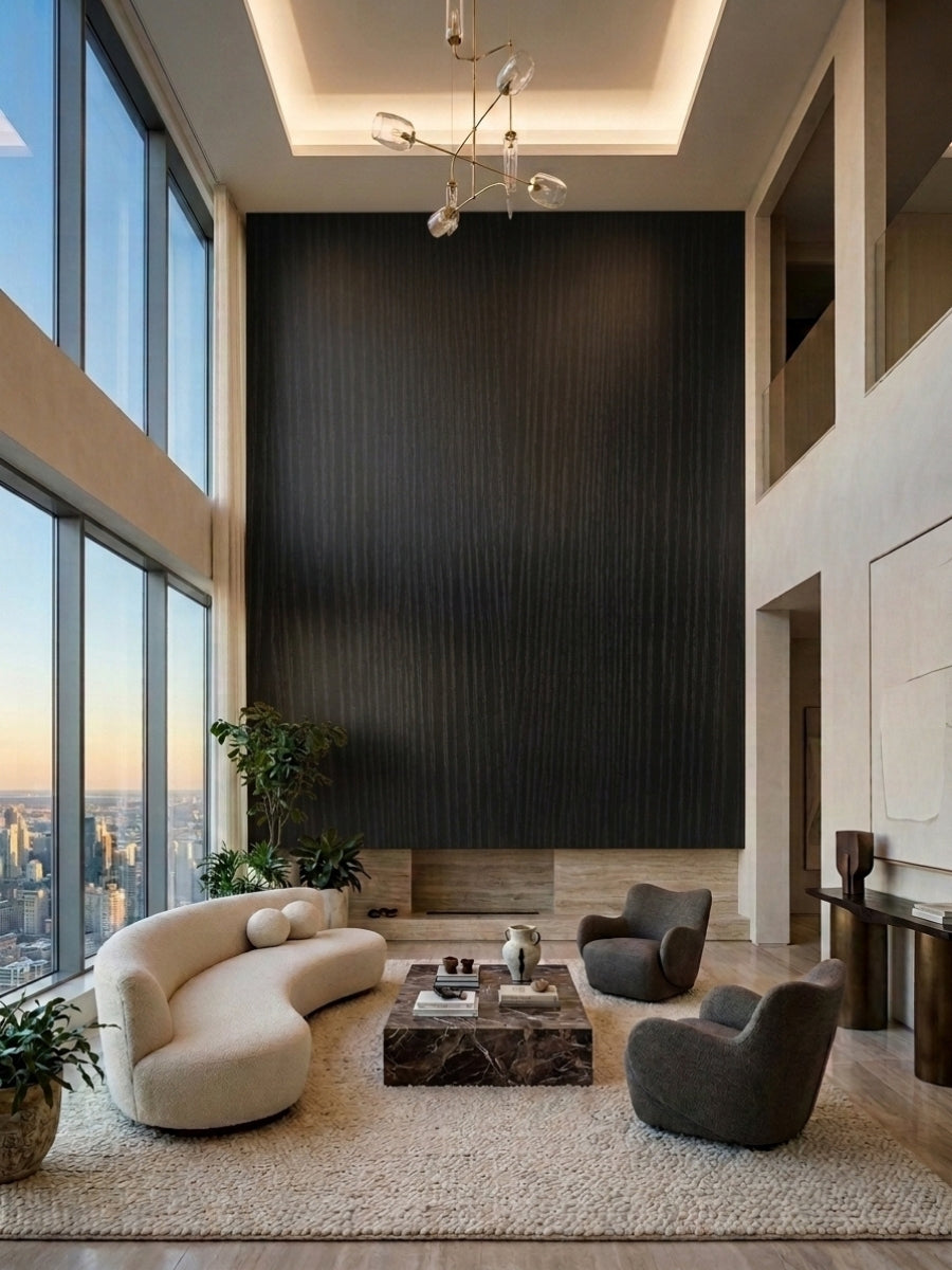 Floor-to-ceiling Blackwood veneer wall panels creating a dramatic dark accent wall in a high-rise lounge