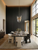 Blackwood veneer wall panels with subtle vertical grain installed behind a contemporary dining area
