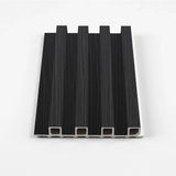 Black Timber WPC slat fluted wall panel sample with four raised vertical ribs