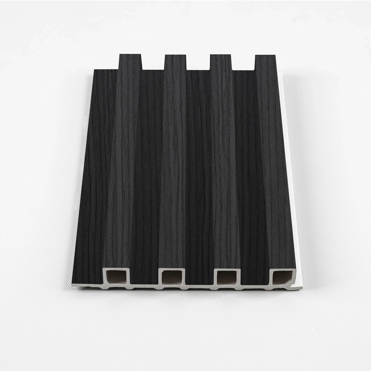 Black Timber WPC slat fluted wall panel sample with four raised vertical ribs