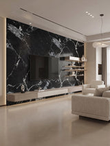 Black and white marble-look PVC wall panels installed as a TV accent wall in a modern living room