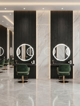 Blackwood WPC fluted wall panels behind illuminated round mirrors in a modern beauty salon