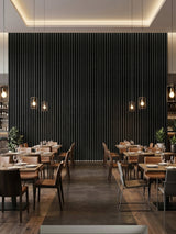 Blackwood WPC fluted panels covering a tall restaurant accent wall above dining tables