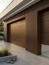 Brown composite wide exterior cladding surrounding wood-grain garage doors on a modern facade
