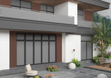 Dark brown composite exterior cladding installed around windows on a modern home with glass balcony railings