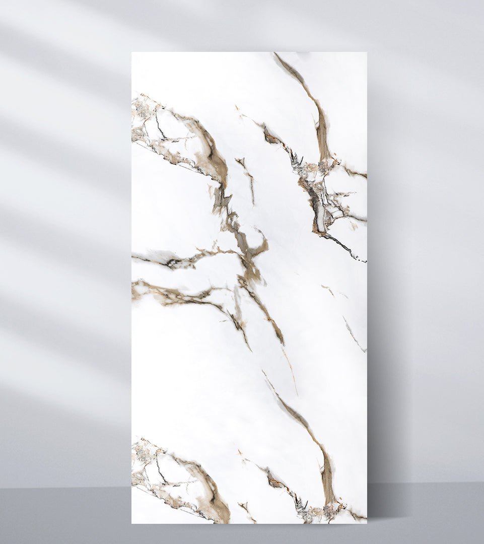 White PVC marble sheet sample with bold branching taupe, gray and gold-toned veins