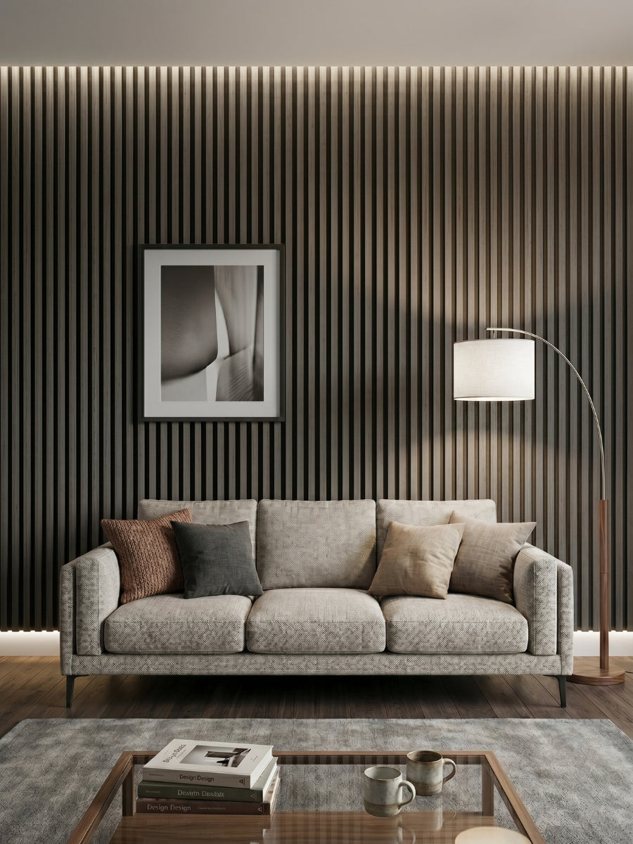 Carborn Gray WPC fluted 3D wall panels covering a living room wall behind a gray sofa