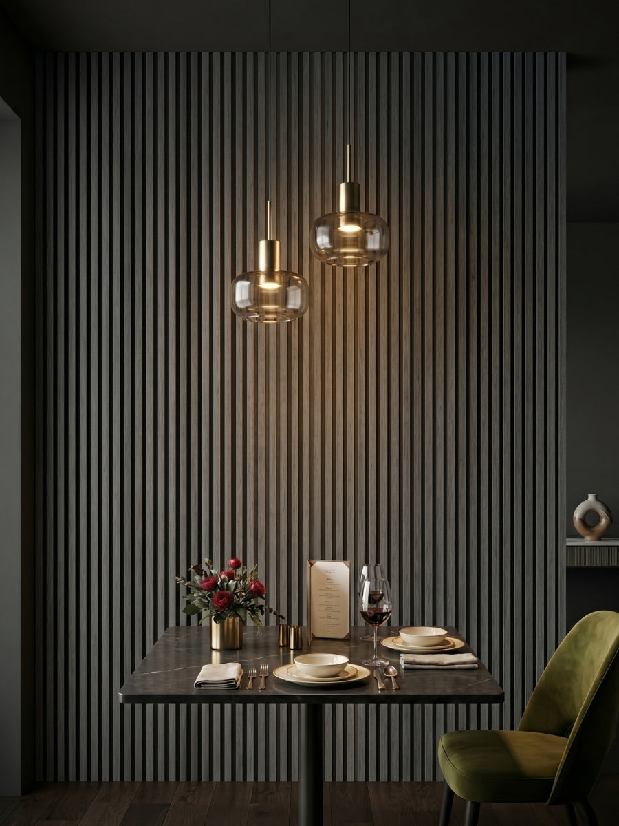 Carborn Gray WPC fluted 3D wall panels installed behind a dining table with pendant lights