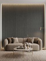 Carborn Gray WPC fluted 3D wall panels installed as a lighted living room feature wall behind a sofa