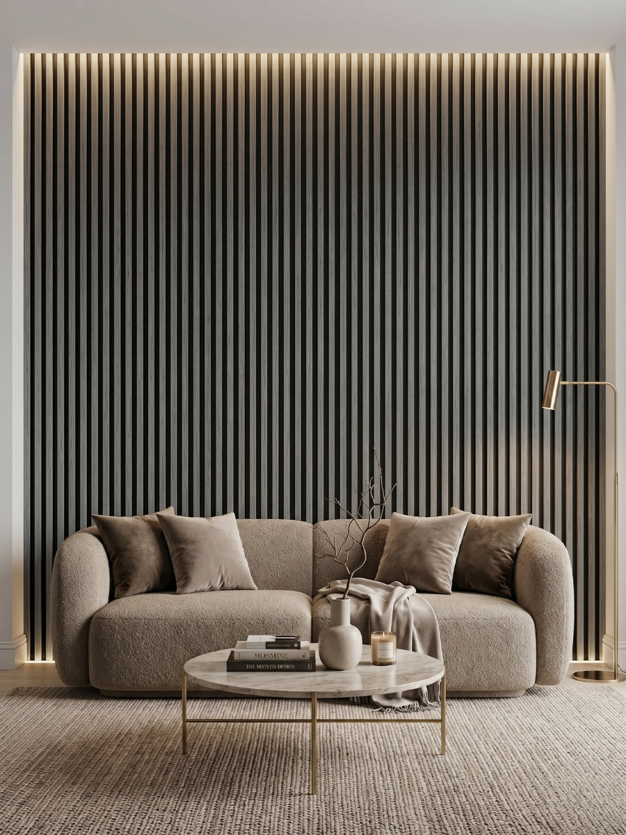 Carborn Gray WPC fluted 3D wall panels installed as a lighted living room feature wall behind a sofa
