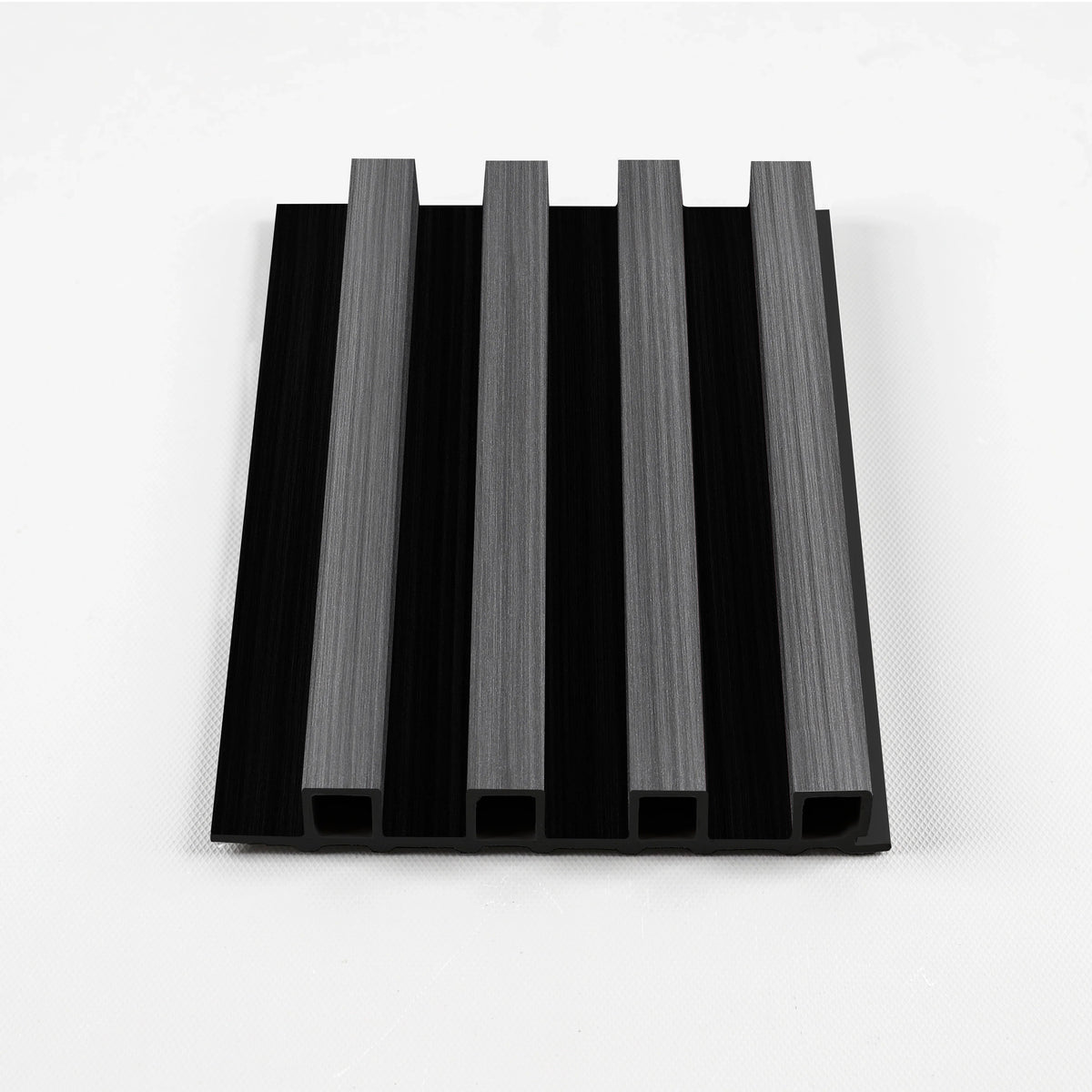 Carbon gray WPC fluted wall panel sample with gray ribs and black recessed grooves