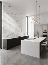 Caramel Vein PVC marble sheets installed as veined wall panels in a modern white kitchen