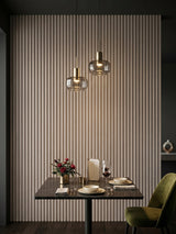 Nordic Birch WPC fluted 3D wall panels installed behind a dining table with pendant lights