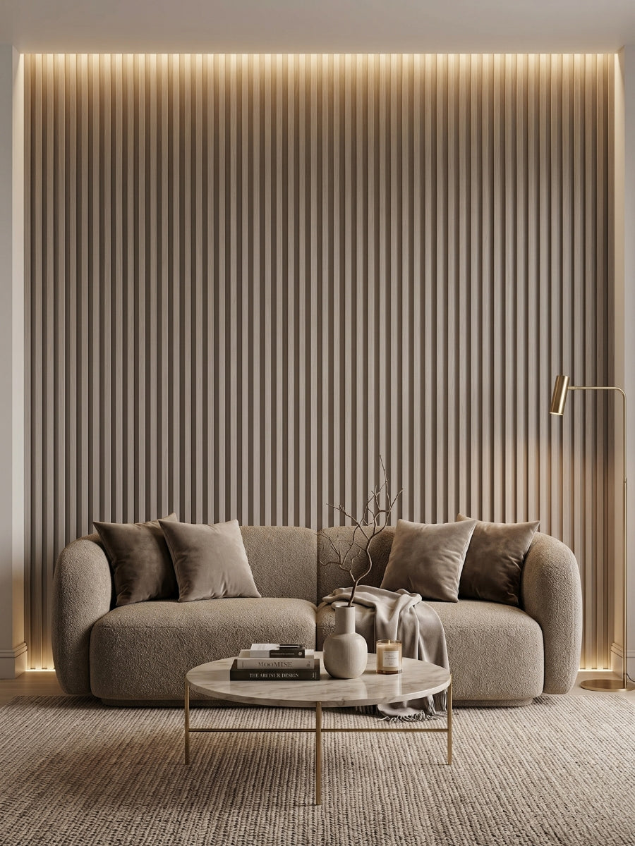 Nordic Birch WPC fluted panels forming a softly lit living room accent wall behind a sofa