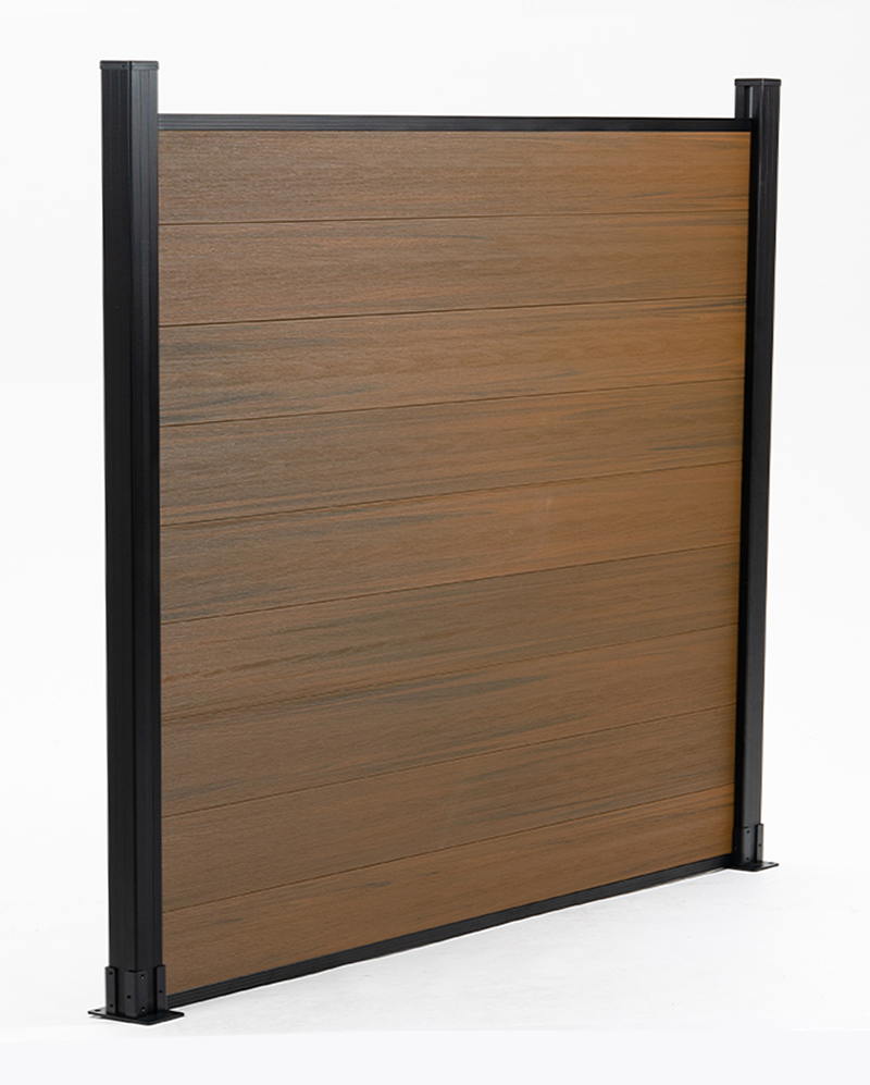 Angled view of walnut co-extruded composite fence panel with horizontal boards and black frame
