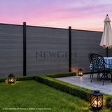 Light gray co-extrusion composite fence beside a patio dining area at sunset