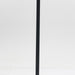 Tall black metal floor lamp with white cylindrical fabric shade