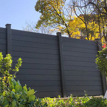 Dark gray composite fence with horizontal boards and vertical posts