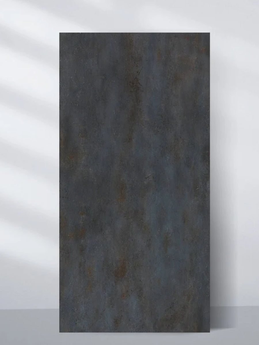 Graphite charcoal PVC stone panel with a dark mottled rough texture and subtle rust-toned accents