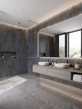 Waterproof graphite charcoal PVC stone panels lining a modern bathroom with glass shower and double vanity