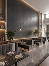 Graphite charcoal rough-texture PVC stone panels forming a tall illuminated accent wall in a contemporary restaurant