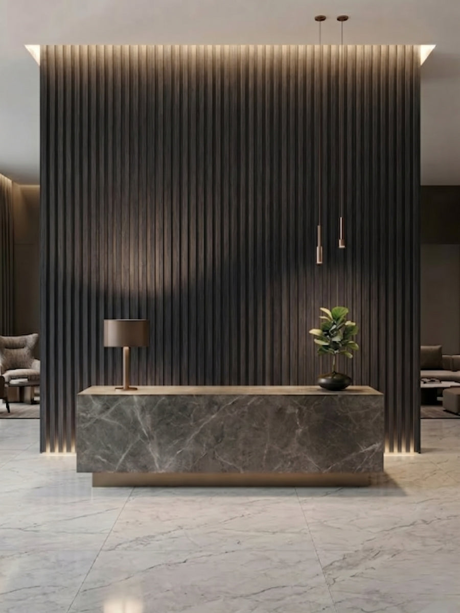Dark Smoky Oak fluted 3D wall panels behind a marble reception desk with accent lighting