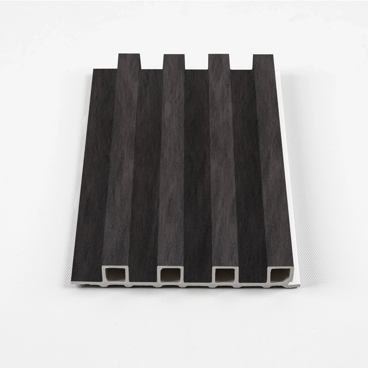 Dark Smoky Oak WPC slat fluted wall panel sample with deep vertical grooves