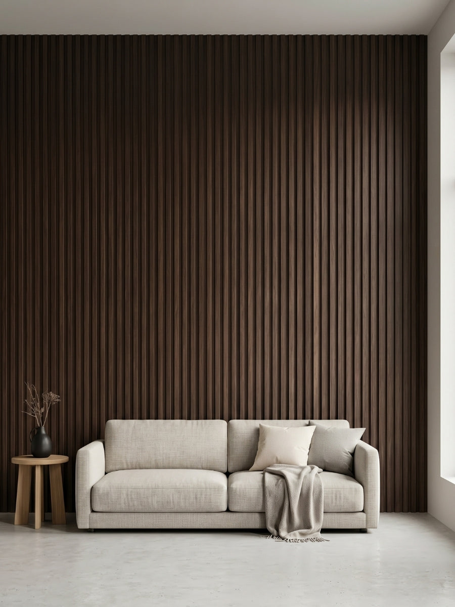 Dark Walnut Oak WPC fluted 3D wall panels installed behind a light sofa in a modern living room