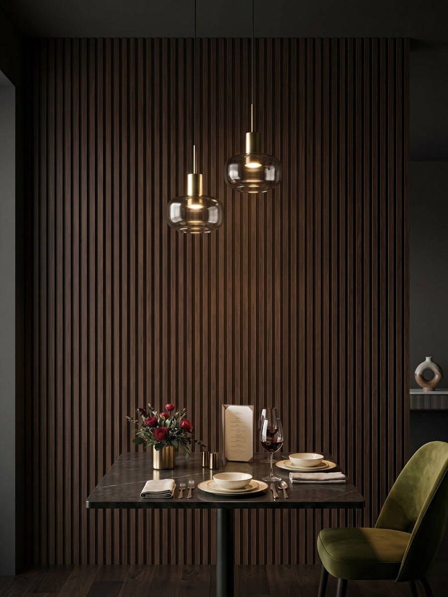 Dark Walnut Oak WPC fluted wall panels creating a vertical slat accent wall in an intimate dining area