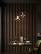 Dark Walnut Oak WPC fluted wall panels creating a vertical slat accent wall in an intimate dining area