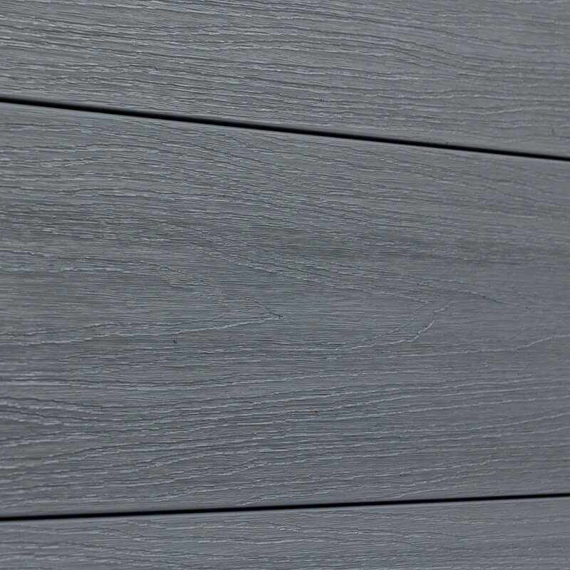 Close-up of light gray composite fence boards with wood-grain texture and horizontal joints