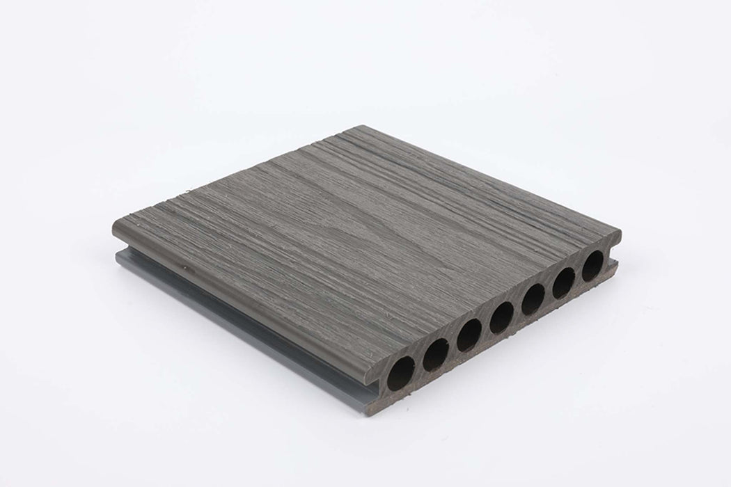 Dark grey wood grain composite deck board with grooved surface