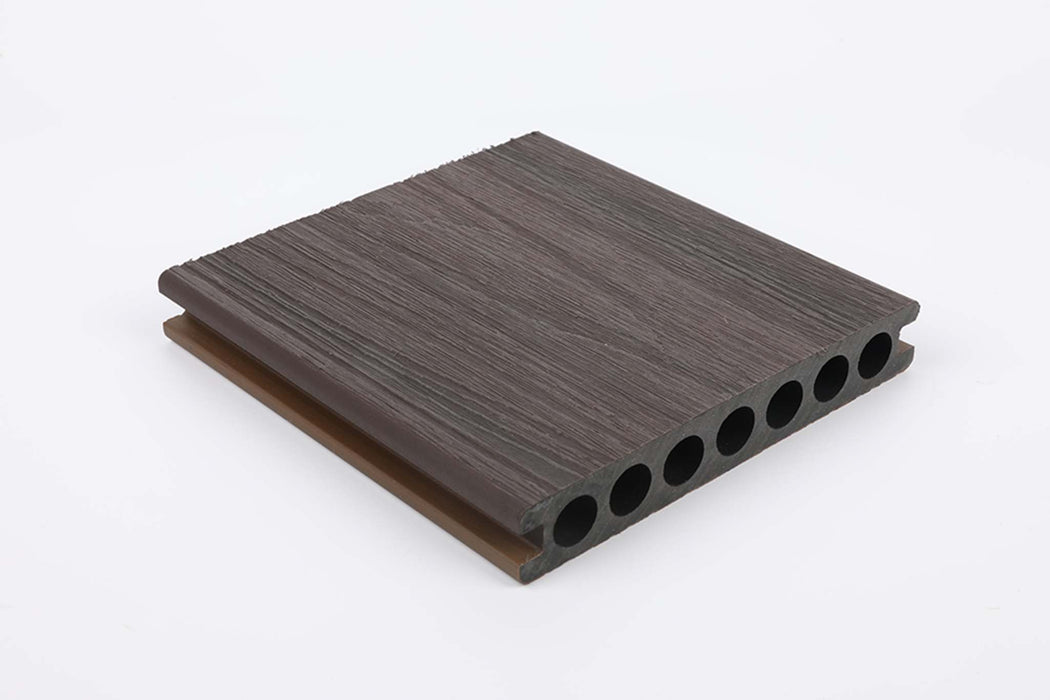 Dark brown mahogany composite deck board with grooved surface