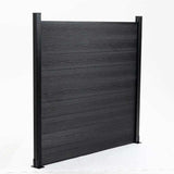 Three-quarter view of a black composite privacy fence panel supported by two posts