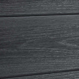 Close-up of embossed wood-grain texture across black composite fence boards