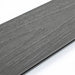 Dark gray co-extruded composite decking with natural wood grain