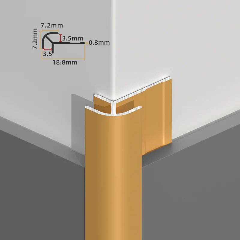Gold rounded aluminum outside corner trim installed over white wall panels with profile dimensions