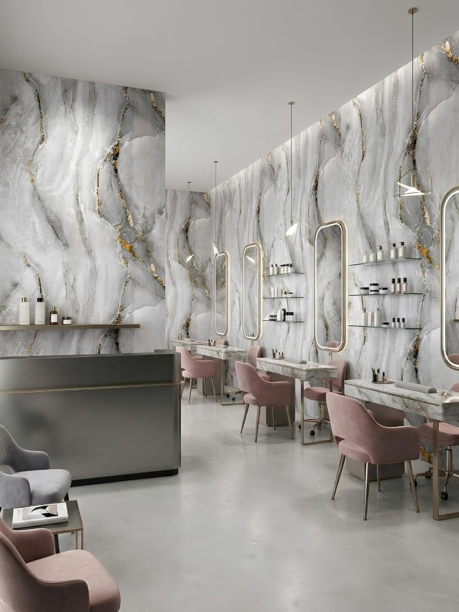 Golden Mirage marble-look PVC sheets installed throughout a modern beauty salon with illuminated mirrors and pink chairs