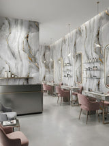 Golden Mirage marble-look PVC sheets installed throughout a modern beauty salon with illuminated mirrors and pink chairs