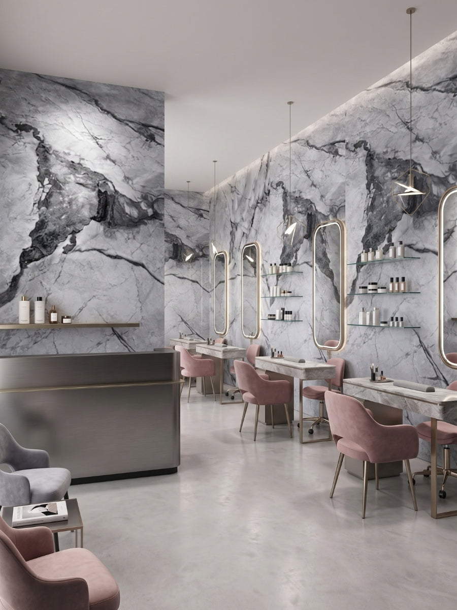 Modern salon with gray-brown marble-look PVC wall panels, styling mirrors, and pink chairs