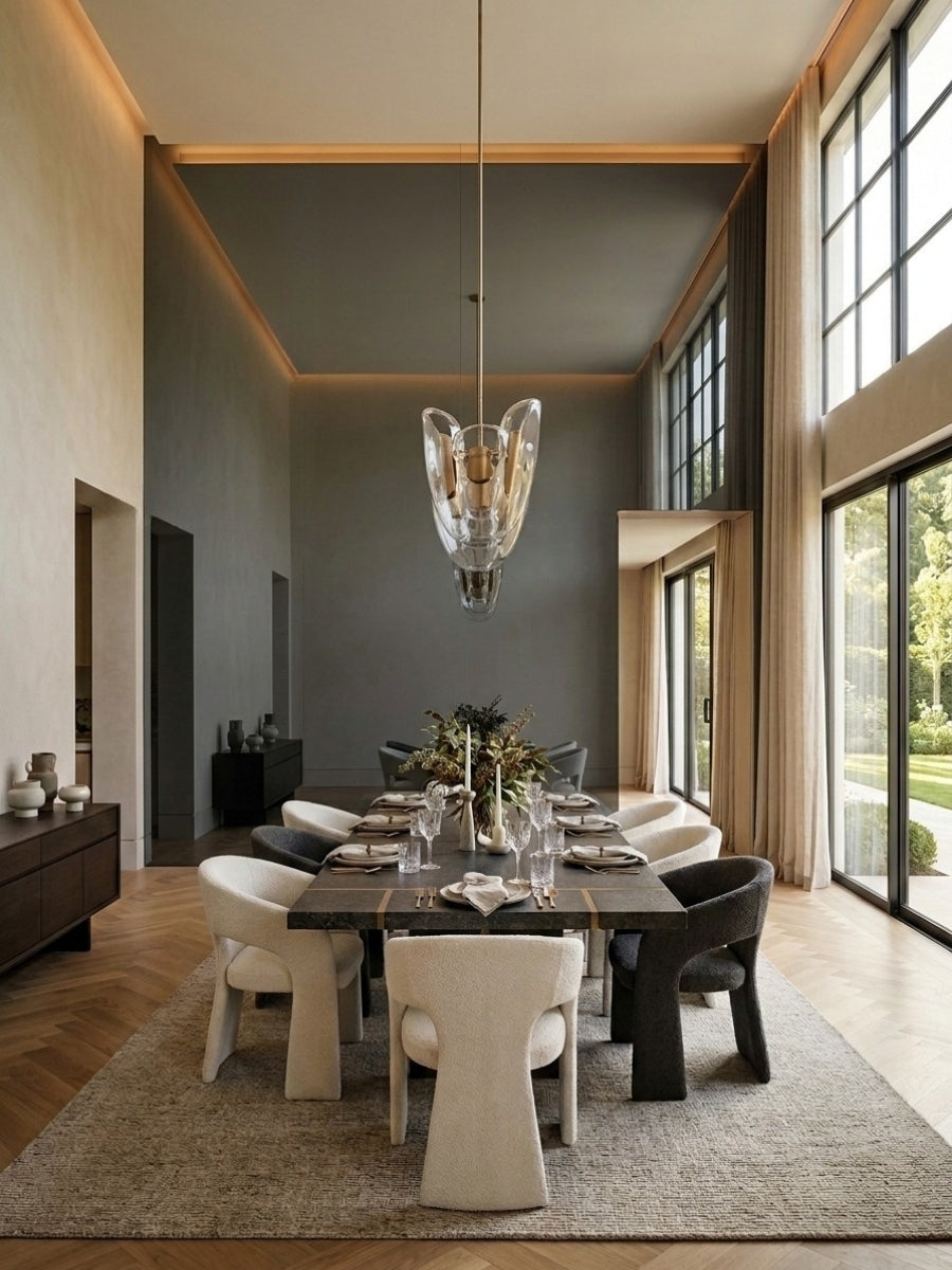 Contemporary dining room with a gray mirror wood veneer panel accent wall and pendant lighting