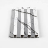 Gray vein WPC fluted wall panel sample with white marble-look surfaces
