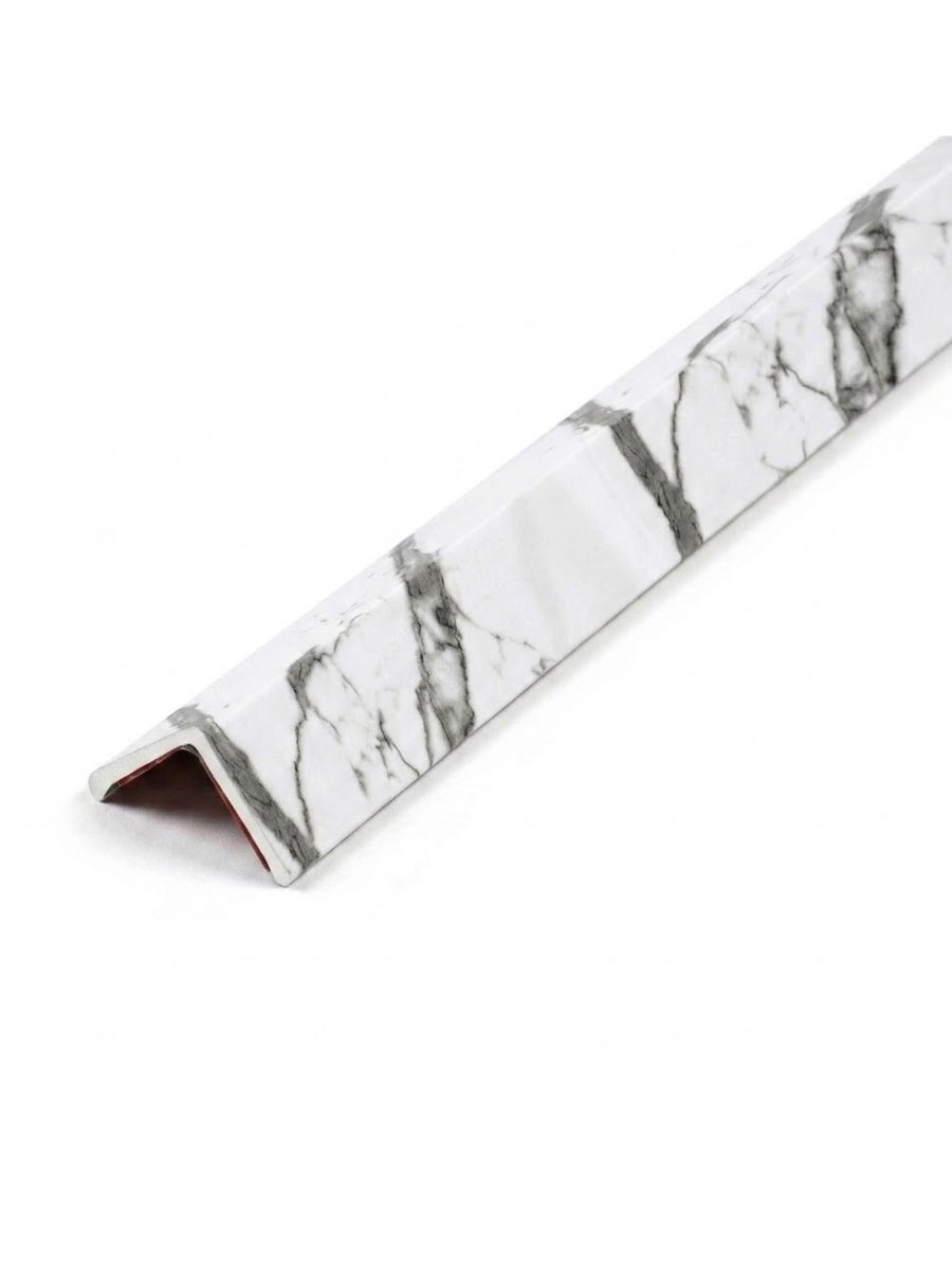 L-shaped acoustic and fluted wall panel trim with a white marble-look finish and gray veining