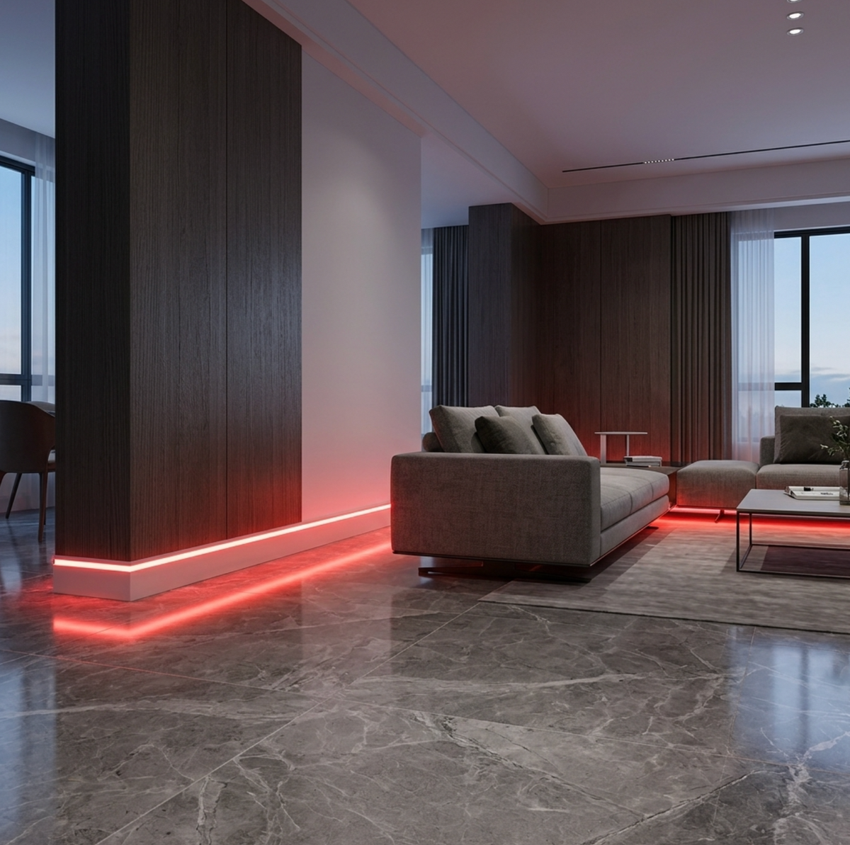 Premium white aluminum LED baseboard molding installed in a modern living room with red floor-level RGB lighting