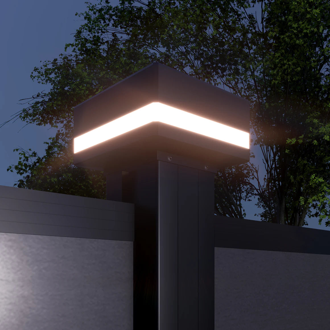 LED cap glowing on a black composite fence post at night beneath trees