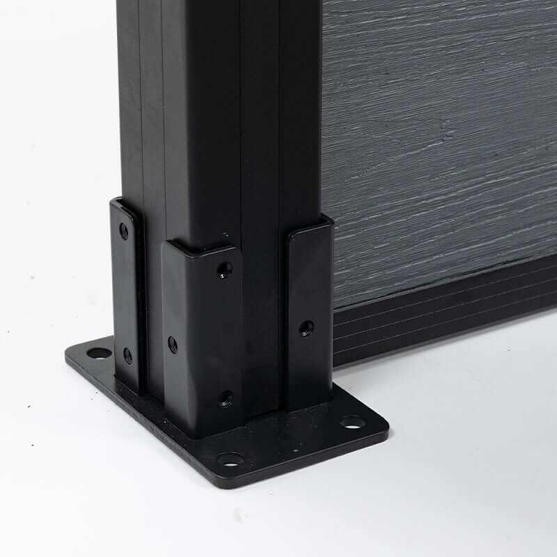 Close-up of the light gray composite fence post base plate and black mounting brackets