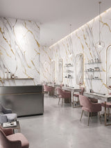 Luxe Gold Vein Marble PVC wall panels lining a bright salon with mirrors, product shelves, and pink chairs