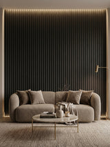 Luxe Noir WPC fluted 3D panels covering a softly lit living room wall behind a curved sofa