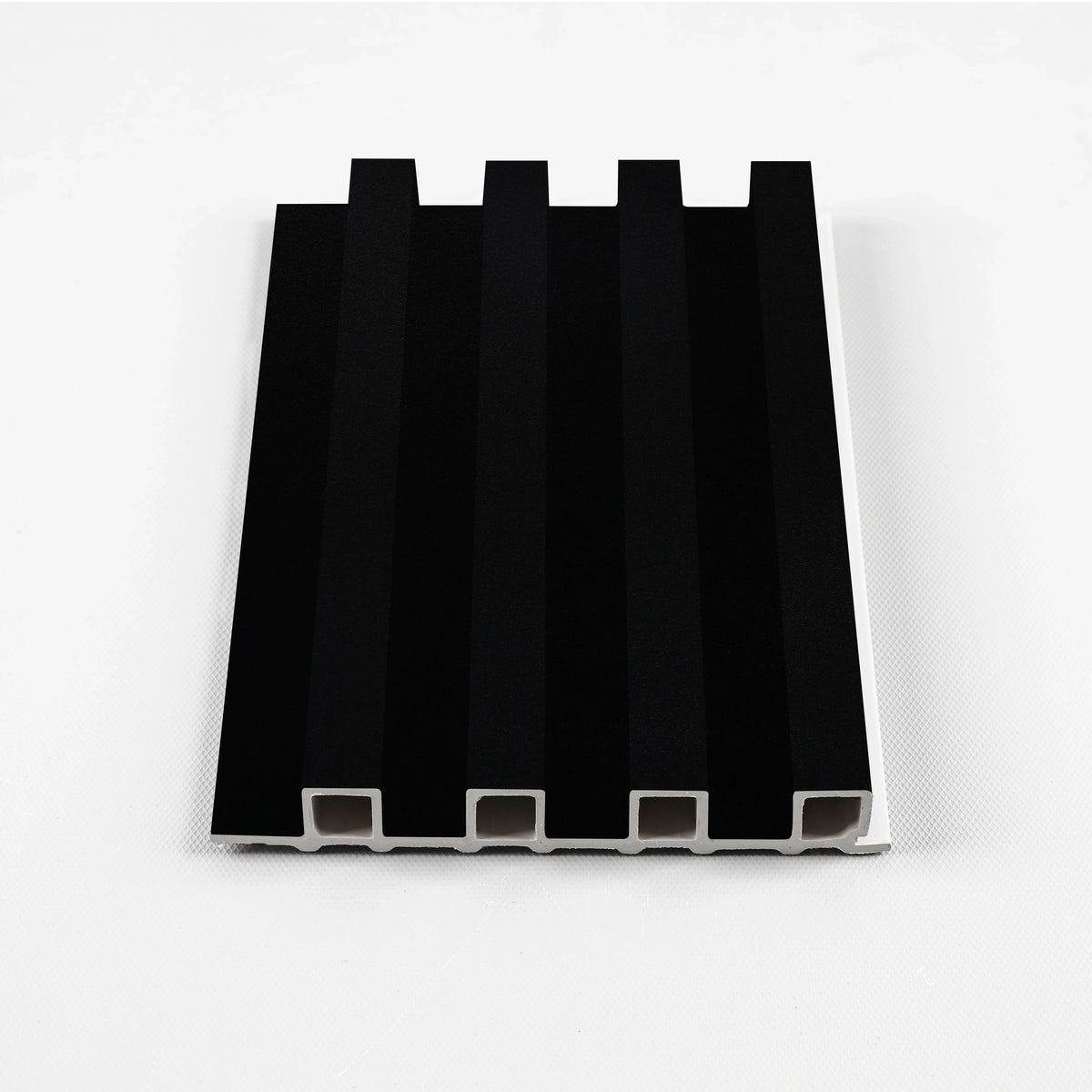 Luxe Noir WPC slat fluted wall panel sample in a solid matte black finish