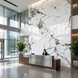 Glossy Glacier Vein marble-look PVC wall panels installed behind a reception desk in a modern glass lobby